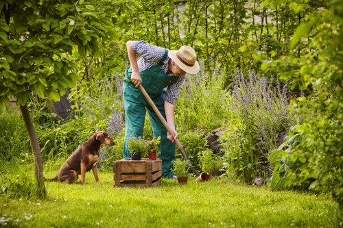 Operative using protective equipment during landscaping work